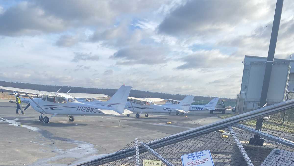 Woman drives car through gates of Norwood Airport