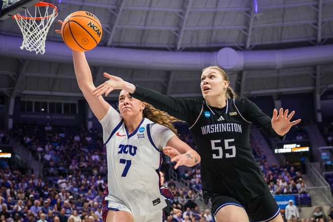 Washington center Yulia Grabovskaia (55) and TCU forward Marta Suárez (7) try to keep the ball inbounds during the first half in the second round of the NCAA college basketball tournament Sunday, March 22, 2026, Fort Worth, Texas.