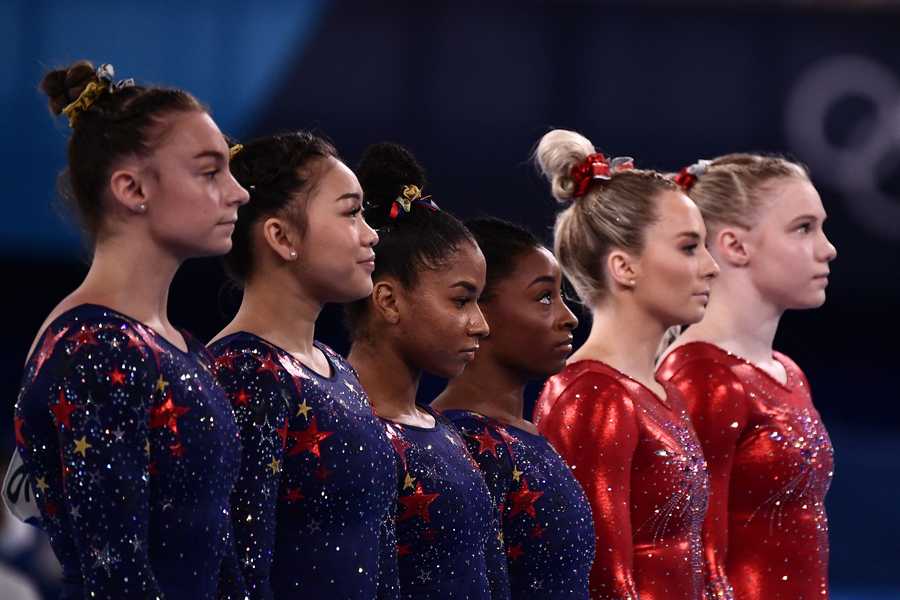 Team USA USA's Grace Mc Callum, USA's Sunisa Lee, USA's Jordan Chiles and USA's Simone Biles wait before competing in the artistic gymnastic women's qualification during the Tokyo 2020 Olympic Games at the Ariake Gymnastics Centre in Tokyo on July 25, 2021.