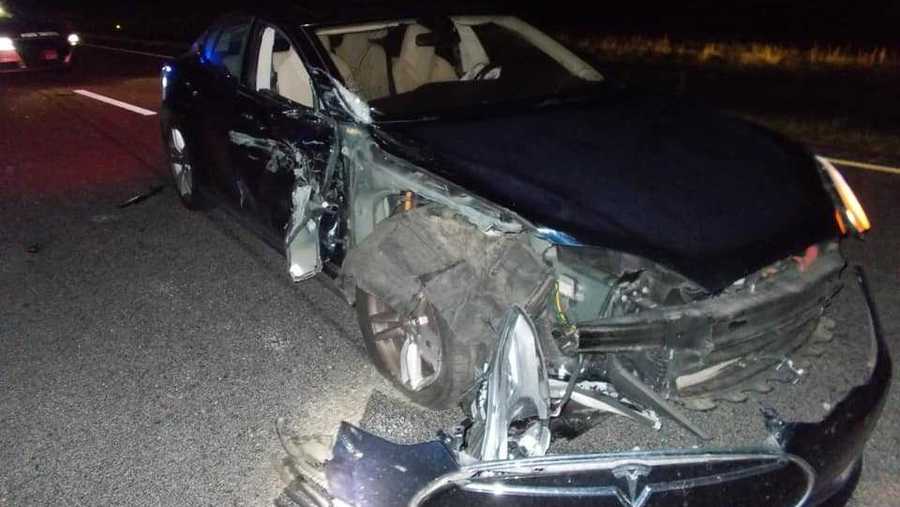 A Tesla was significantly damaged after authorities said a doctor was watching a movie while the car was on autopilot.
