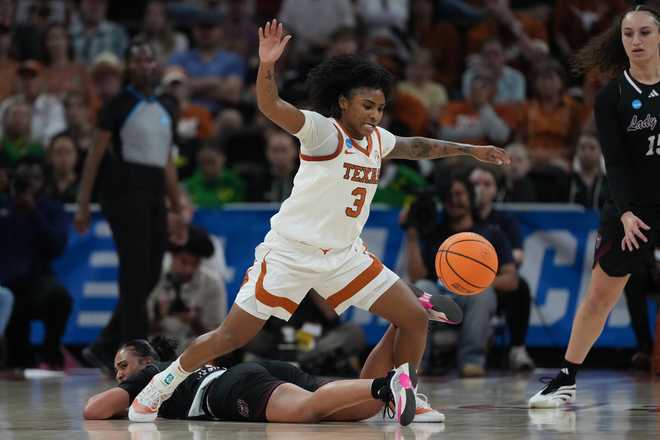 Texas guard Rori Harmon (3) chases a loose ball over Missouri State guard Maycee James (13) during the second half in the first round of the NCAA college basketball tournament game, Friday, March 20, 2026.