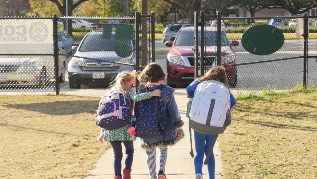 Texas schools must end mask mandates next month after governor signs order