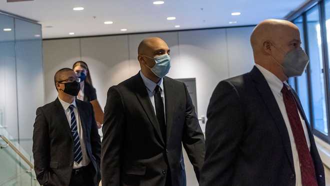 Former&#x20;Minneapolis&#x20;Police&#x20;Officers&#x20;Tou&#x20;Thao&#x20;&#x28;L&#x29;&#x20;and&#x20;Alexander&#x20;Kueng&#x20;&#x28;C&#x29;,&#x20;along&#x20;with&#x20;his&#x20;attorney&#x20;Thomas&#x20;Plunkett&#x20;&#x28;R&#x29;,&#x20;leave&#x20;the&#x20;US&#x20;District&#x20;Court&#x20;in&#x20;St.&#x20;Paul,&#x20;Minnesota,&#x20;on&#x20;Jan.&#x20;11,&#x20;2022,&#x20;after&#x20;their&#x20;pre-trial&#x20;hearing&#x20;along&#x20;with&#x20;one&#x20;other&#x20;former&#x20;Minneapolis&#x20;police&#x20;officer&#x20;charged&#x20;with&#x20;federal&#x20;civil&#x20;rights&#x20;violations&#x20;in&#x20;George&#x20;Floyd&#x27;s&#x20;death.