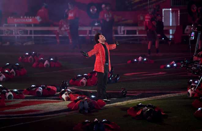 The&#x20;Weeknd&#x20;performs&#x20;on&#x20;the&#x20;field&#x20;surrounded&#x20;by&#x20;collapsed&#x20;performers&#x20;during&#x20;the&#x20;Pepsi&#x20;Super&#x20;Bowl&#x20;LV&#x20;Halftime&#x20;Show&#x20;at&#x20;Raymond&#x20;James&#x20;Stadium&#x20;on&#x20;February&#x20;07,&#x20;2021&#x20;in&#x20;Tampa,&#x20;Florida.