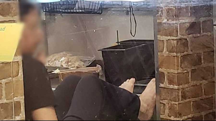 Woman with feet on counter at Subway