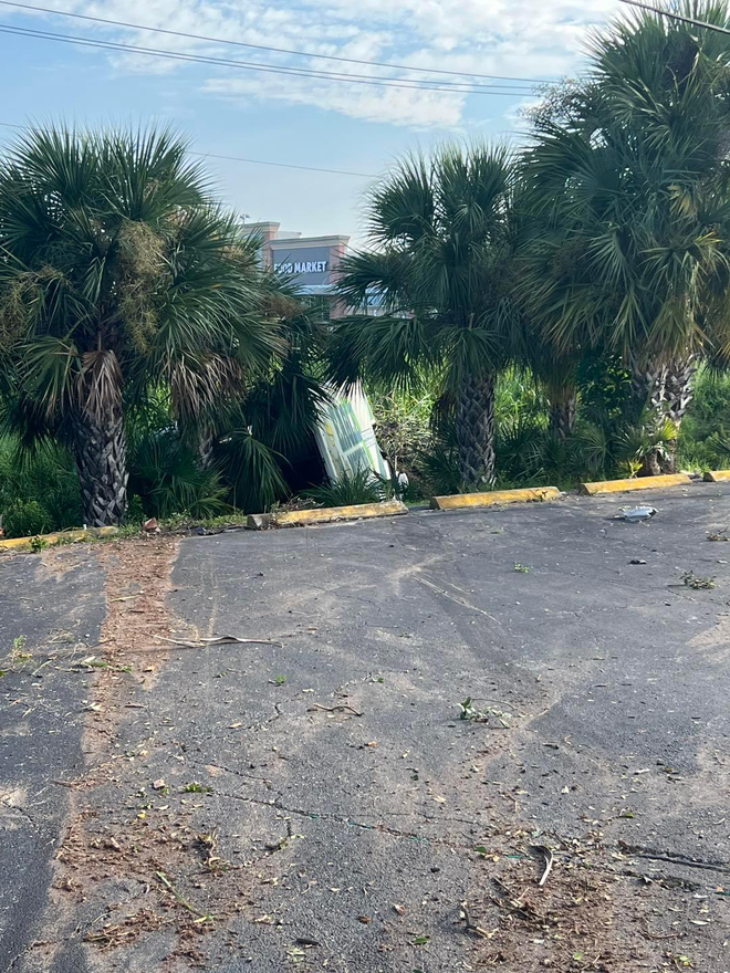 Moving truck crashes into cars and lands in south Fort Myers drainage canal.
