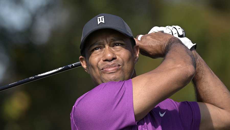 FILE - Tiger Woods watches his tee shot on the first hole during the first round of the PNC Championship golf tournament in Orlando, Fla., in this Dec. 19, 2020, file photo.