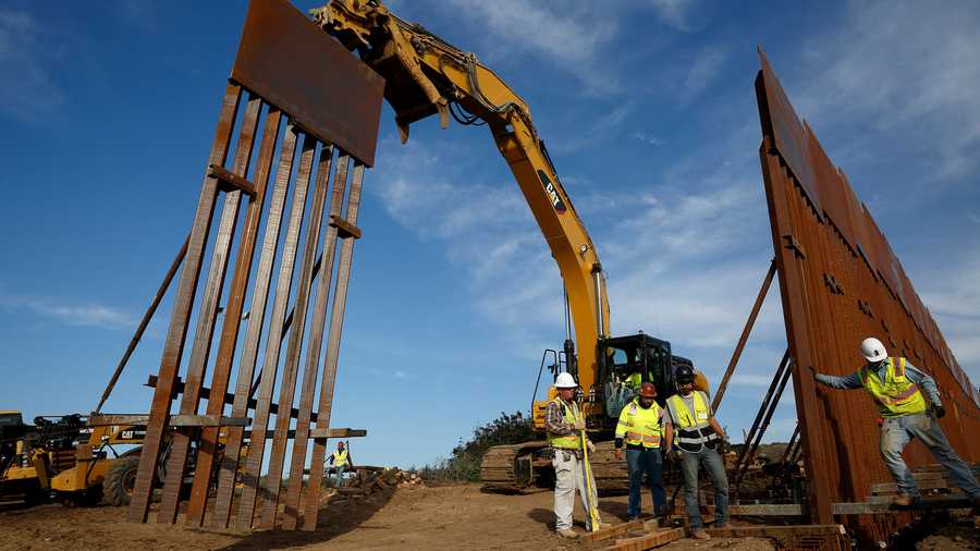 In this file photo, construction crews install new border wall sections seen from Tijuana, Mexico., Jan. 9, 2019. An anti-immigration group scored a legal victory on Friday, Aug. 12, 2022, in its federal lawsuit arguing the Biden administration violated environmental law when it halted construction of the U.S. southern border wall and sought to undo other immigration policies by former President Donald Trump.
