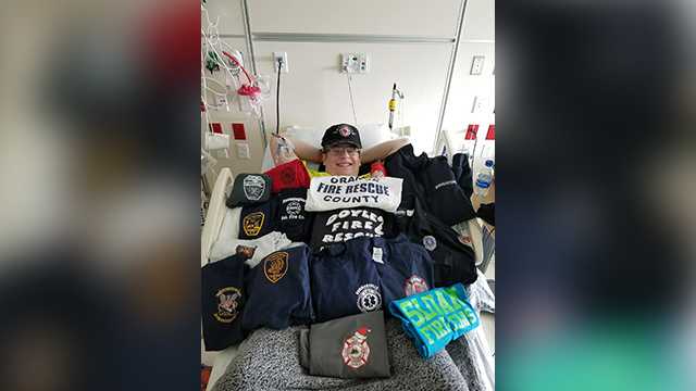 Timothy Richardson, a 16-year-old who hopes to be a firefighter, is surrounded by t-shirts from fire departments while he's in the hospital for Leukemia treatments.