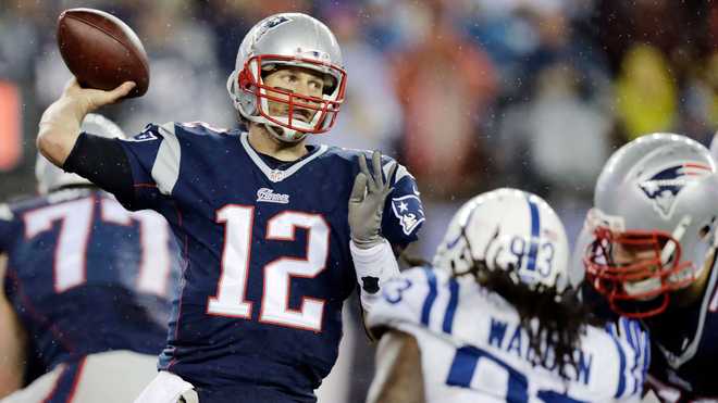 In this Dec. 2, 2018, file photo, New England Patriots quarterback Tom Brady  celebrates a touchdown during an NFL football game against the Minnesota  Vikings at Gillette Stadium in Foxborough, Mas …