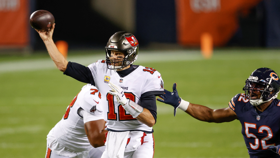 Tampa Bay Buccaneers quarterback Tom Brady (12) looks to pass the ball against the Chicago Bears during the first half of an NFL football game, Thursday, Oct. 8, 2020, in Chicago. (AP Photo/Kamil Krzaczynski)