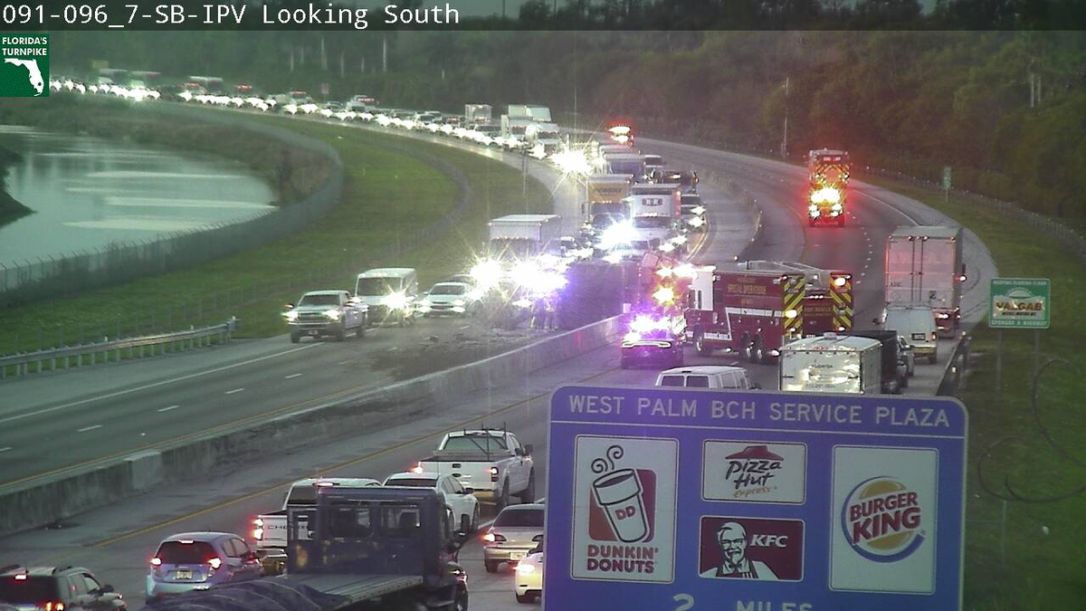 Tractor trailer blocking both north, southbound turnpike lanes