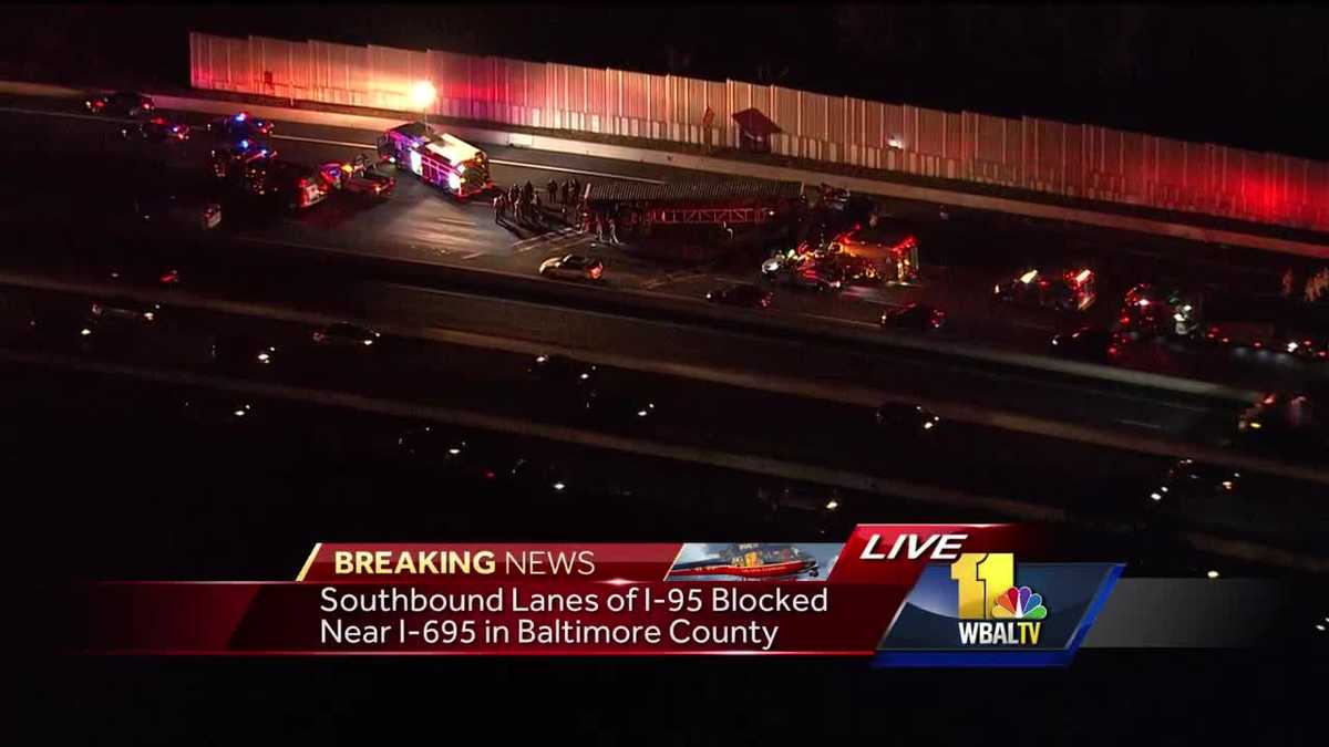 Overturned tractor trailer blocks traffic along SB I-95 near I-695