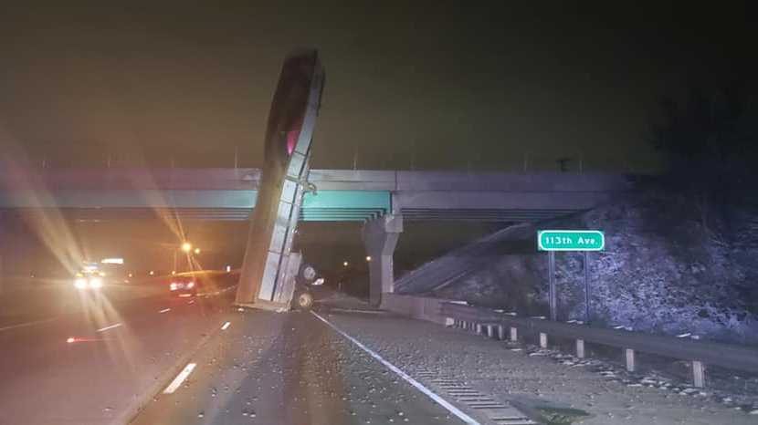 A dump trailer was elevated and then struck an overpass