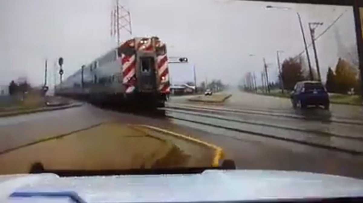Terrifying video Officer narrowly avoids being struck by train