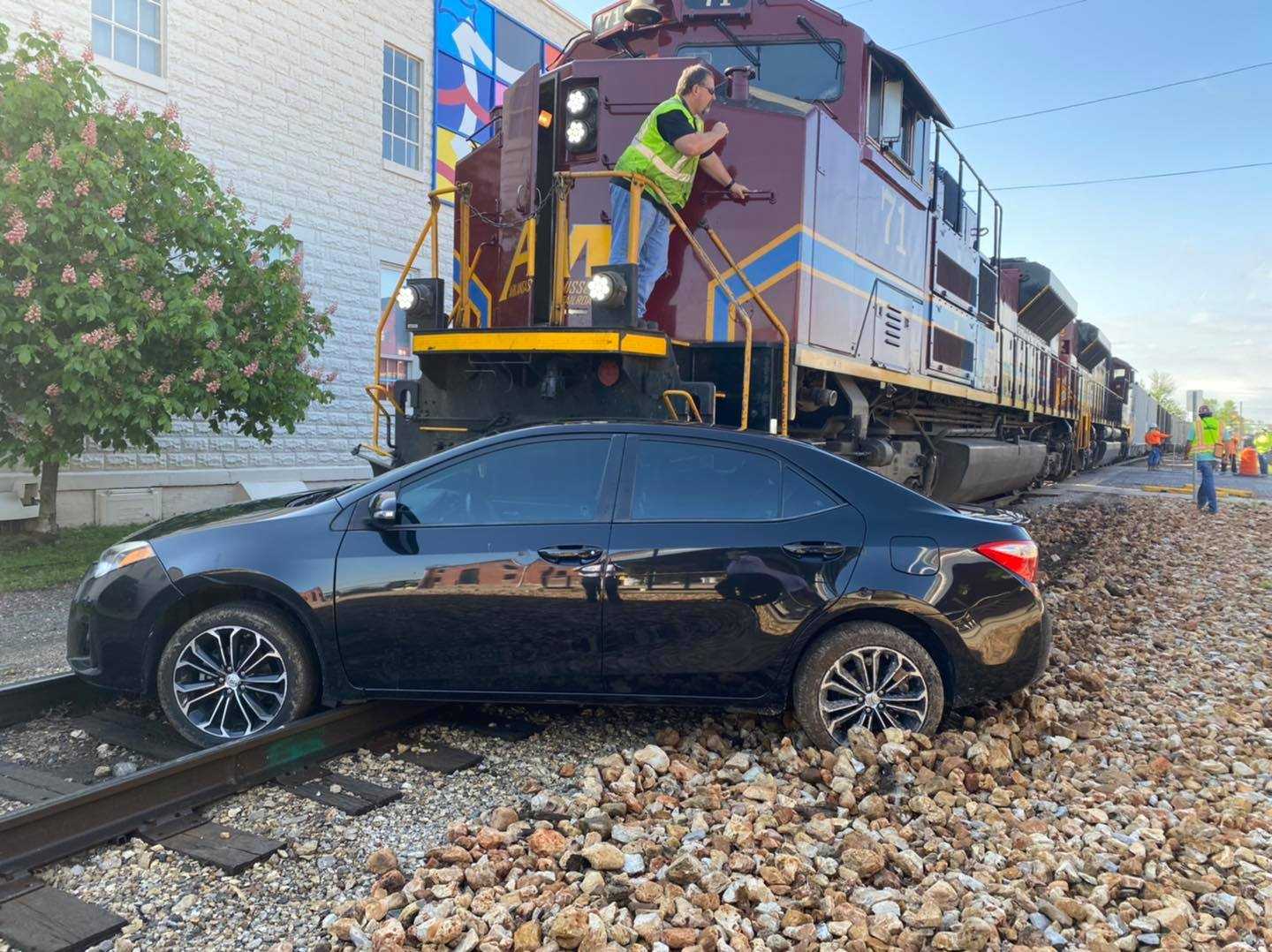 Train hits car on tracks in Rogers