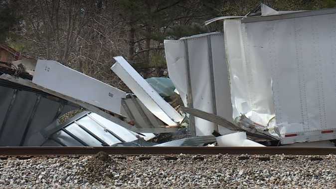 Tractor trailer gets stuck on tracks, train hits tractor trailer ...
