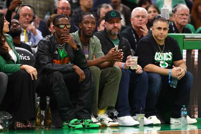 Rapper Travis Scott looks on during Game 2 of the 2024 NBA Finals between the Boston Celtics and the Dallas Mavericks at TD Garden on June 9, 2024 in Boston, Massachusetts.