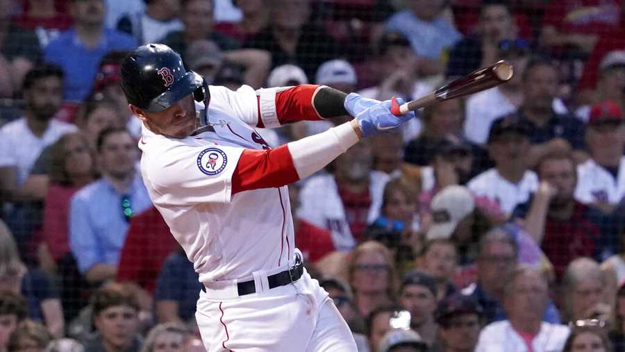 Boston Red Sox&apos;s Trevor Story follows through on a two-run single during the fourth inning of the team&apos;s baseball game against the St. Louis Cardinals at Fenway Park, Friday, June 17, 2022, in Boston. (AP Photo/Mary Schwalm)