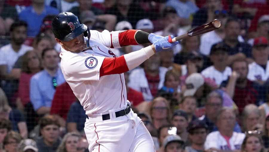 Boston Red Sox&apos;s Trevor Story follows through on a two-run single during the fourth inning of the team&apos;s baseball game against the St. Louis Cardinals at Fenway Park, Friday, June 17, 2022, in Boston. (AP Photo/Mary Schwalm)