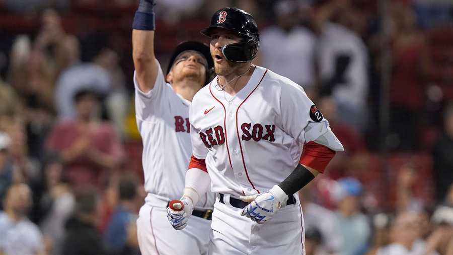 Boston Red Sox's Trevor Story, right, celebrates his home run with Christian Vazquez, left, in the seventh inning of a baseball game against the Houston Astros, Monday, May 16, 2022, in Boston. The Red Sox won 6-3.