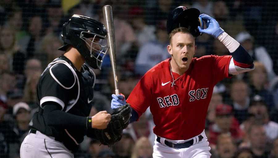 Boston Red Sox&apos;s Trevor Story reacts after being called out on strikes, next to Chicago White Sox catcher Reese McGuire (21) during the fifth inning of a baseball game at Fenway Park, Friday, May 6, 2022, in Boston. (AP Photo/Mary Schwalm)
