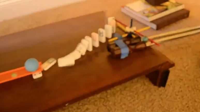 A screenshot from Richardson's announcement video showing one small step in his elaborate Rube Goldberg machine. 