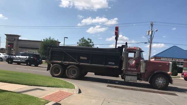 Man dies after being hit by dump truck in Moore
