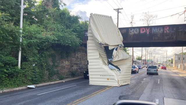 Truck carrying container crashes into railroad bridge - Vimarsana News