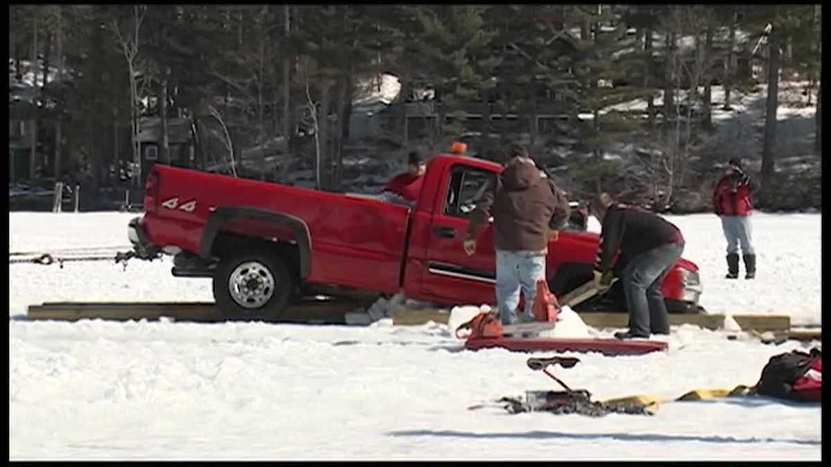 Crews work to retrieve truck that broke through ice into lake