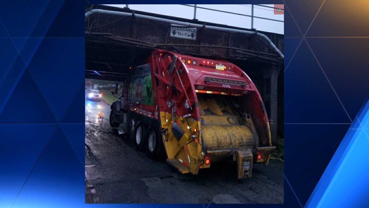 TRASH TRUCK runs into Amtrak bridge gets stuck