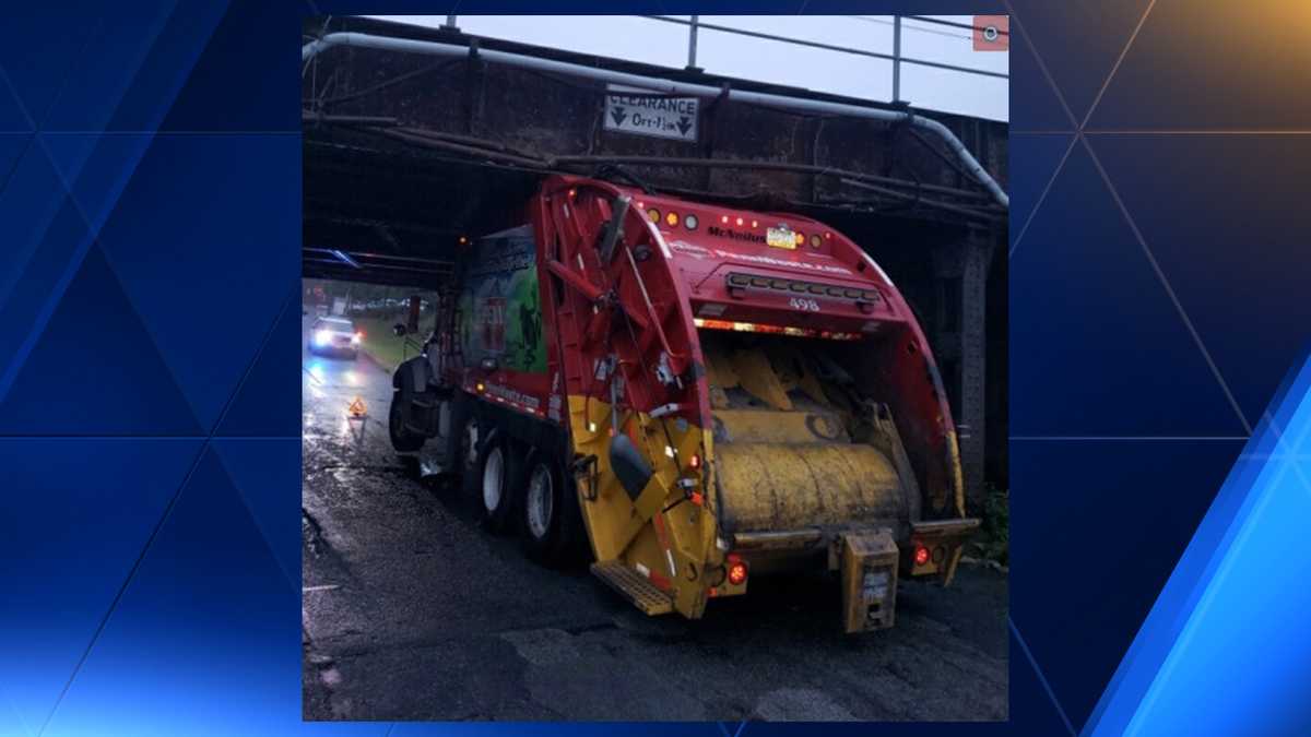 TRASH TRUCK runs into Amtrak bridge, gets stuck