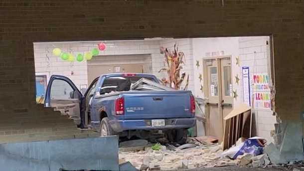 At least 1 injured after truck crashes into school