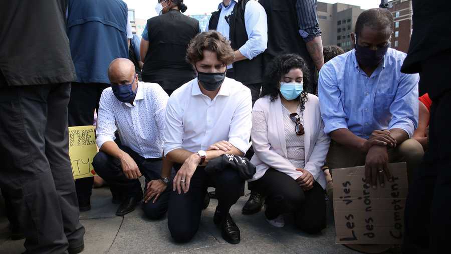 Canadian Prime Minister Justin Trudeau (2nd L) takes a knee during in a Black Lives Matter protest on Parliament Hill June 5, 2020 in Ottawa, Canada.