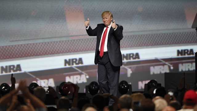 President Donald Trump gestures after speaking at the National Rifle Association-ILA Leadership Forum, Friday, April 28, 2017, in Atlanta. 
