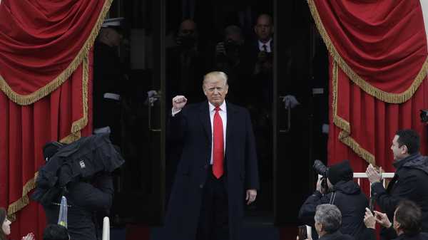 President-elect Donald Trump pumps his fist as he arrives for his Presidential Inauguration at the U.S. Capitol in Washington, Friday, Jan. 20, 2017.