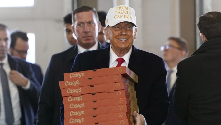 Iowa caucuses: Trump hands out Casey's pizza in Waukee