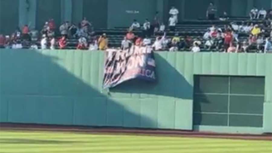 A fan was escorted from Fenway Park on June 7, 2021 after unfurling a "Trump won" banner over the centerfield wall during the fourth inning of the Boston Red Sox's game against the Miami Marlins.