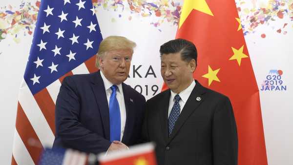 President Donald Trump poses for a photo with Chinese President Xi Jinping during a meeting on the sidelines of the G-20 summit in Osaka, Japan, Saturday, June 29, 2019.