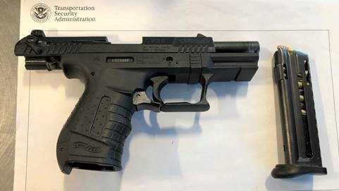 Gun at DSM Airport