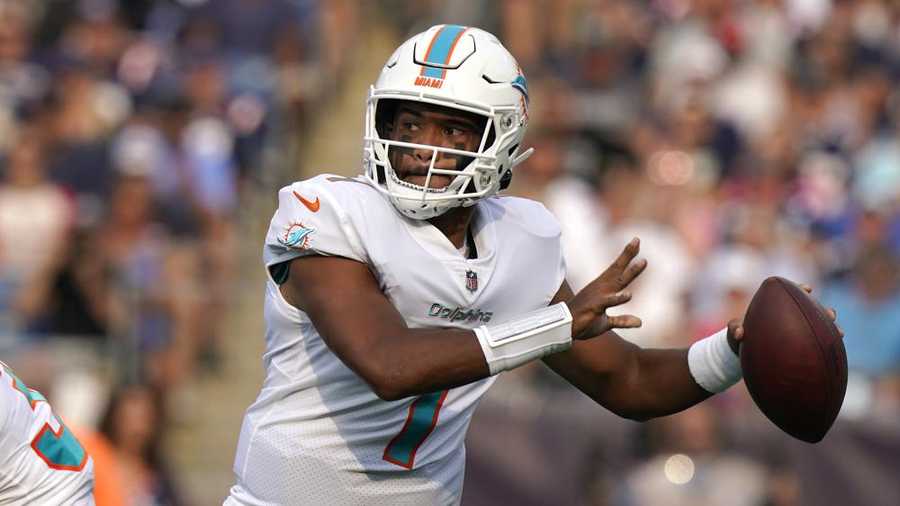 tua tagovailoa throws a pass in the dolphins 17-16 win over the patriots
