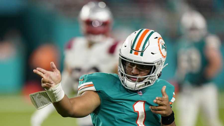 miami dolphins quarterback tua tagovailoa (1) celebrates after running to gain yardage, during the second half of an nfl football game against the new england patriots, sunday, jan. 9, 2022, in miami gardens, fla. (ap photo/wilfredo lee)
