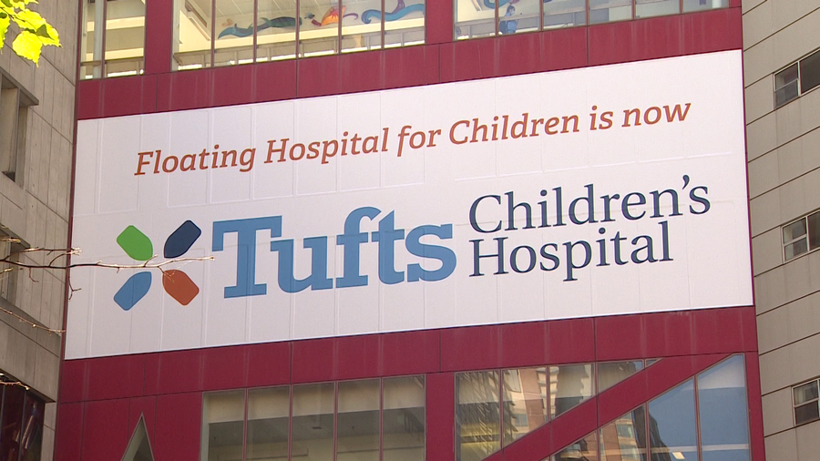 Sign announcing name change of Tufts Children's Hospital