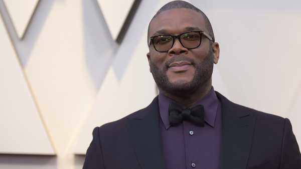 In this Feb. 24, 2019 file photo, Tyler Perry arrives at the Oscars at the Dolby Theatre in Los Angeles. Less than a day after the family of a slain single mother of four launched a fundraising appeal, Perry has lent his support. News outlets report Perry offered to take care of the family’s rent to stave off eviction, arrange for 45-year-old Tynesha Evans’ body to be flown to Wisconsin for burial and cover her 18-year-old daughter’s tuition at Spelman College so she doesn’t have to drop out.(Photo by Richard Shotwell/Invision/AP, File)