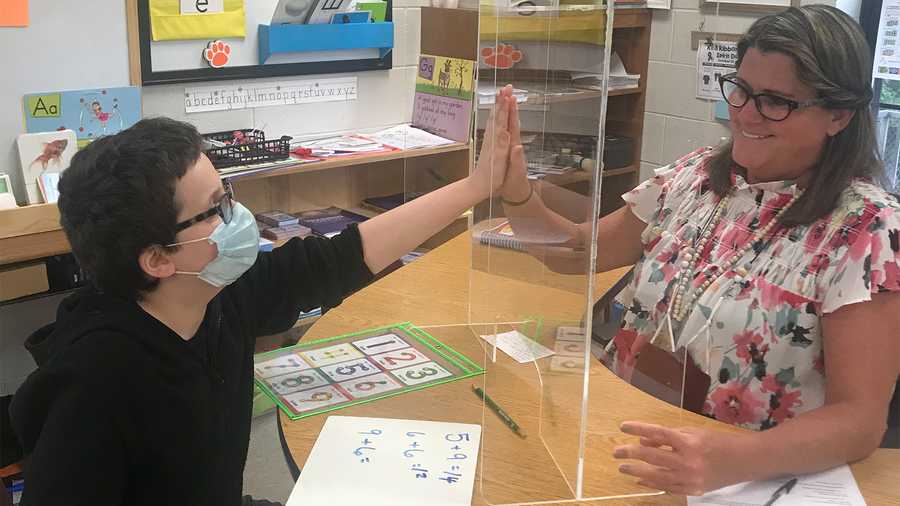 "Who says you can't high-five in schools? Thanks to Mavin Construction Company, the special needs class at Hickory Tavern Elementary in Laurens SC can do just that and more. The company donated 3 thick plexiglass screen guards with slots in the bottom in order to teach one on one instruction and still be safe!! Huge shoutout to this company for their generous donation."