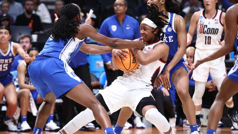 PORTLAND, OREGON - MARCH 30: Jadyn Donovan #4 of the Duke Blue Devils and KK Arnold #2 of the UConn Huskies fight for possession of the ball in the second half of the game during the Sweet Sixteen round of the 2024 NCAA Women&apos;s Basketball Tournament held at the Moda Center on March 30, 2024 in Portland, Oregon.