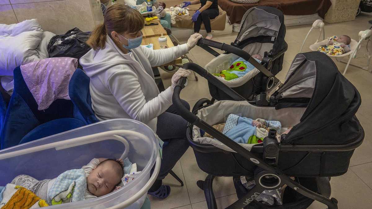 Surrogate babies born in Ukraine wait out war in basement