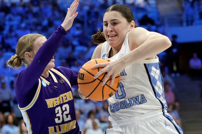 North Carolina guard Lanie Grant (0) drives against Western Illinois guard Kaylen Reed (32) in the second half in the first round of the NCAA college basketball tournament, Friday, March 20, 2026, in Chapel Hill, N.C.