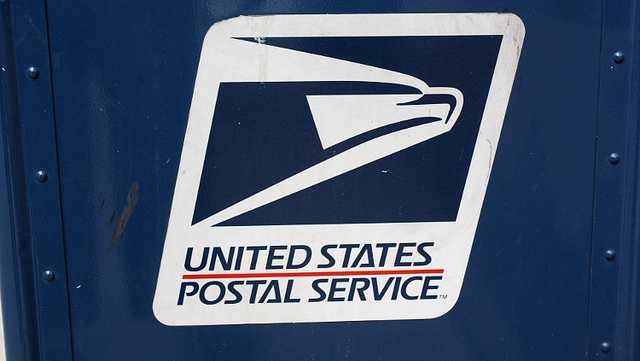 a us postal service mail collection box is shown