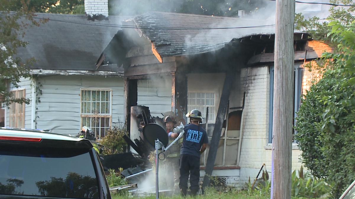 Morning house fire sends one woman to hospital